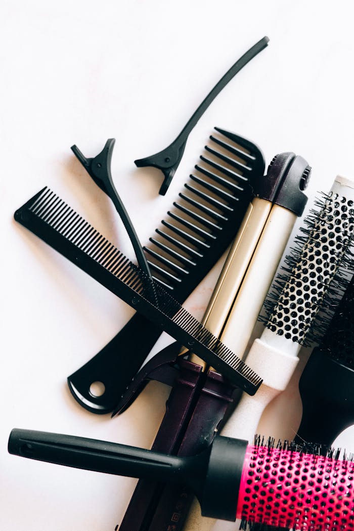 A collection of essential hairdressing tools and accessories for salon use.